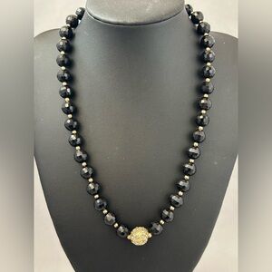 Monet black faceted glass bead necklace with gold tone rhinestone studded bead